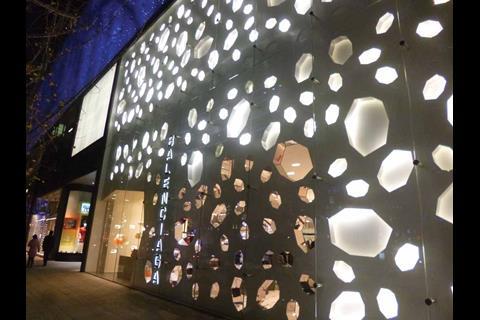Balenciaga’s window is a vast expanse of 3D holes